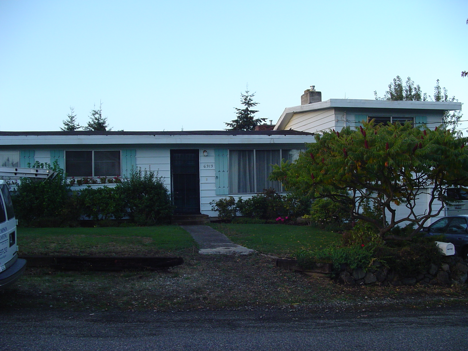Before the green standing seam metal roof installation on a Tacoma-area home