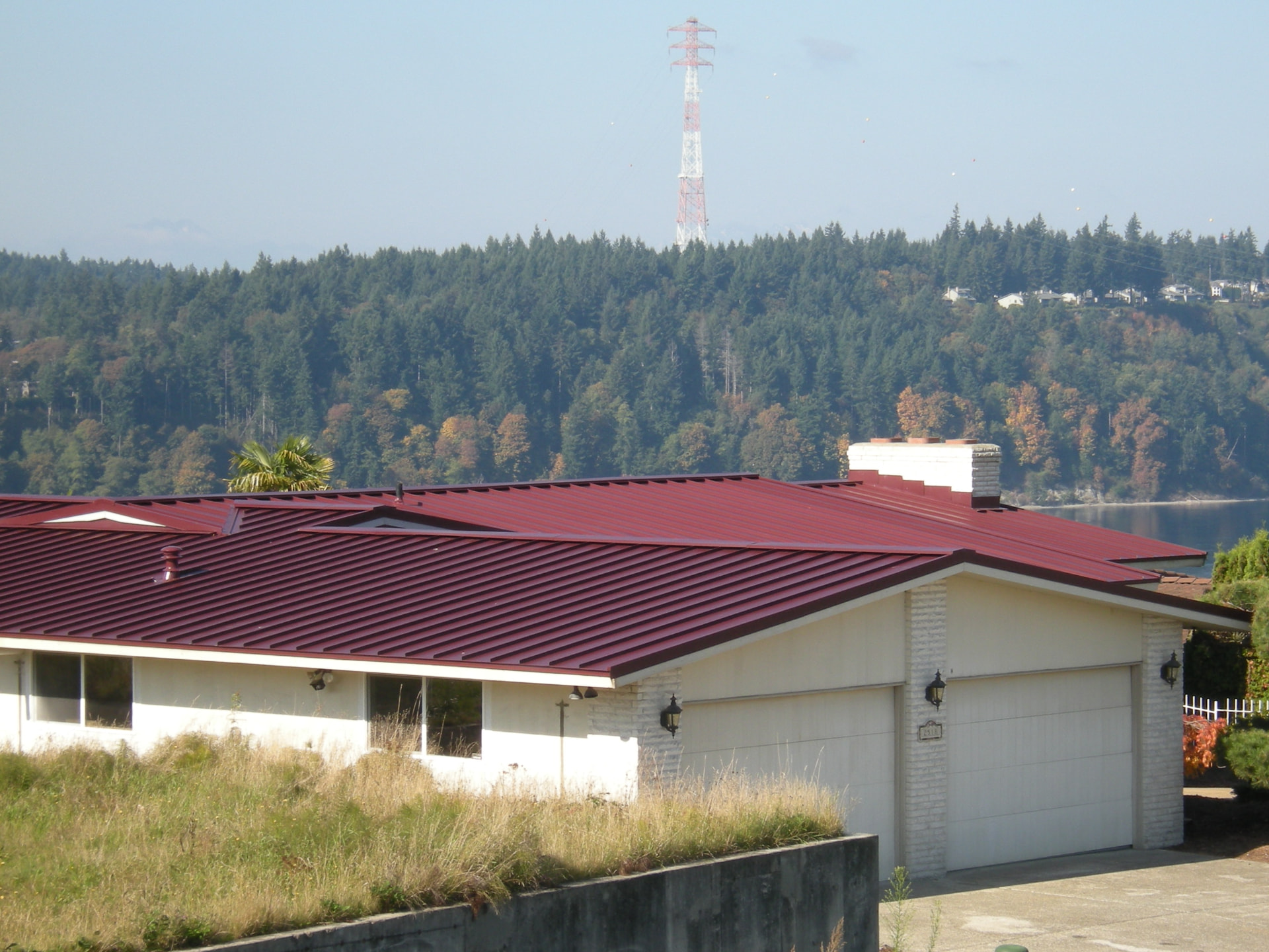 Finished metal roof system with new ridge and flashing in Tacoma