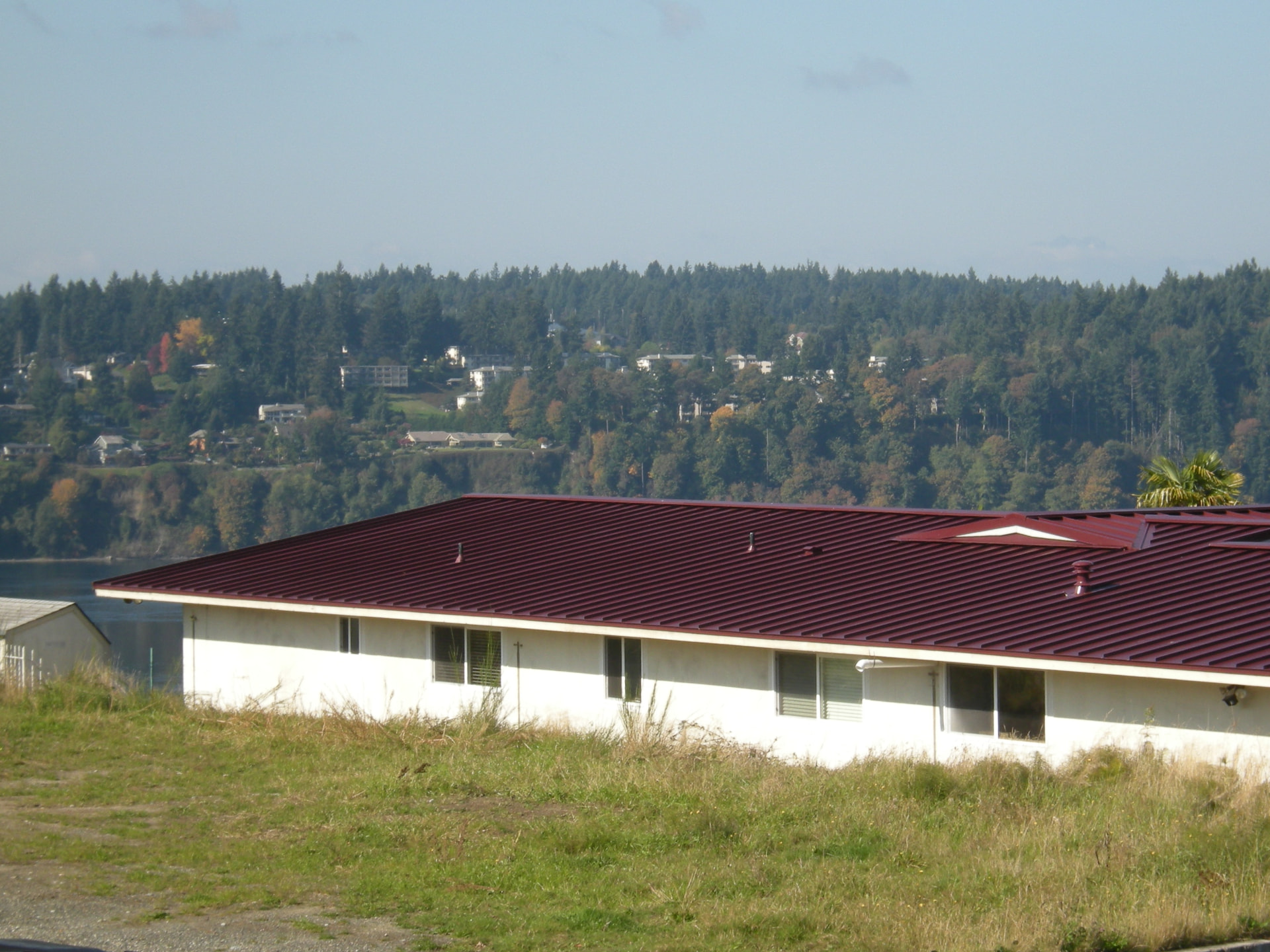 Low slope metal roof completed on a Pacific Northwest ranch home