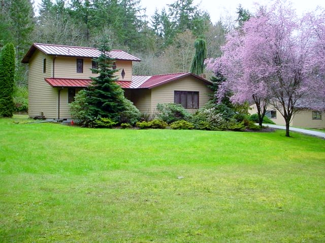 Colonial red metal roof on a rural home near Tacoma, WA
