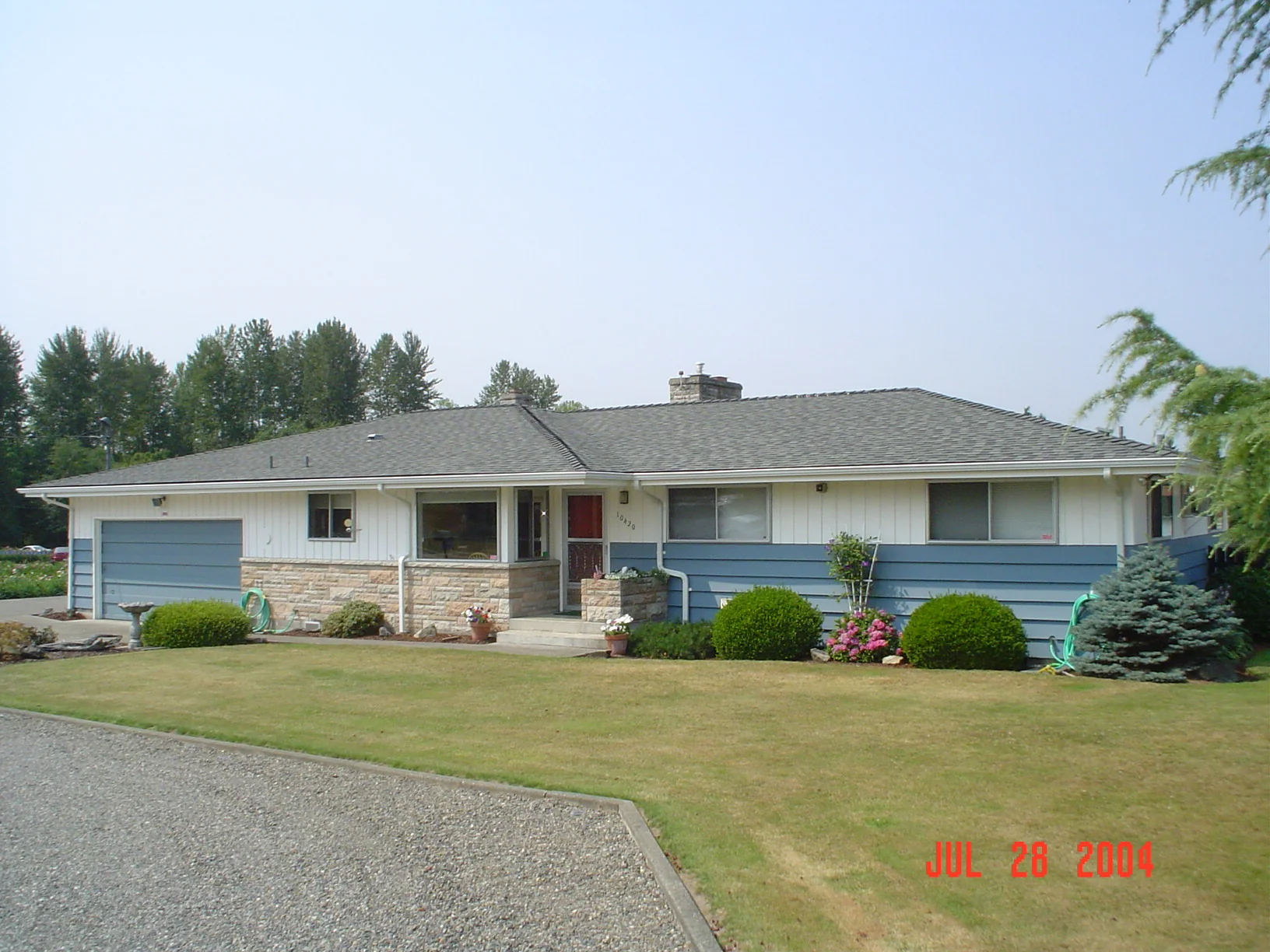 Tacoma ranch home after a gray asphalt shingle roof replacement