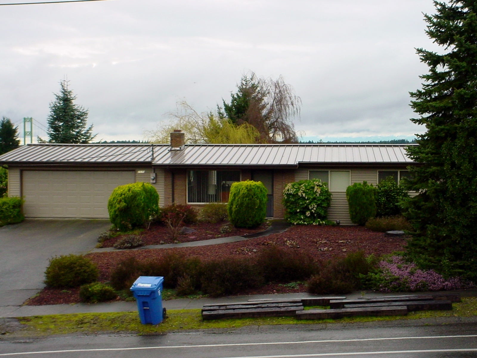 Gray standing seam metal roof with copper details in Pierce County