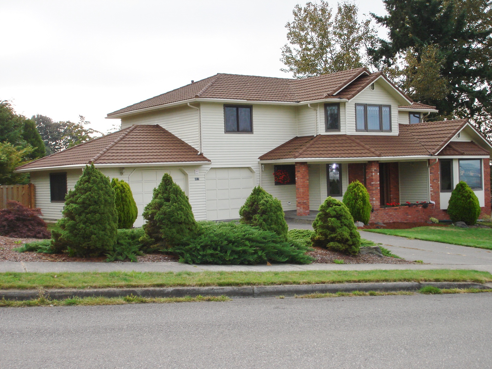 Brown concrete tile roof replacement on a two-story Tacoma home