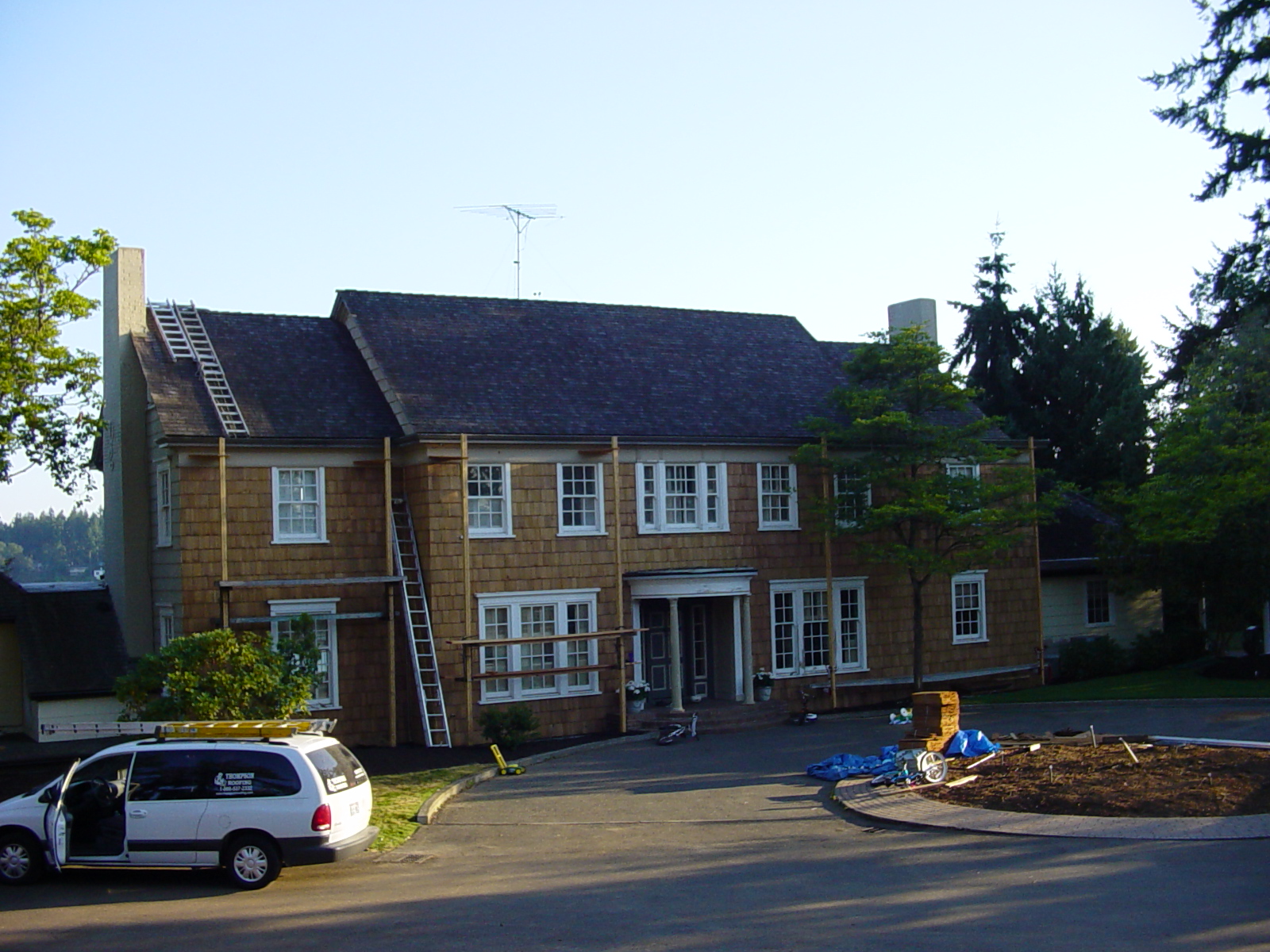 Before the asphalt roof replacement on a large Tacoma-area home